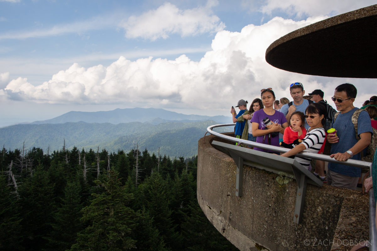 Great Smoky Mountains National Park. A family takes in the views from the observation tower atop Kuwohi