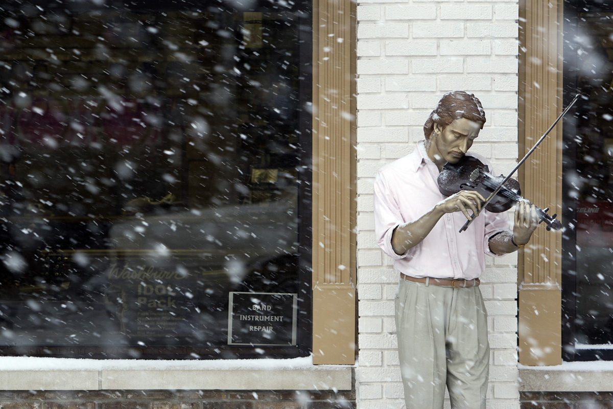 Carmel Indiana winter scene. Snow on a J. Seward Johnson sculpture