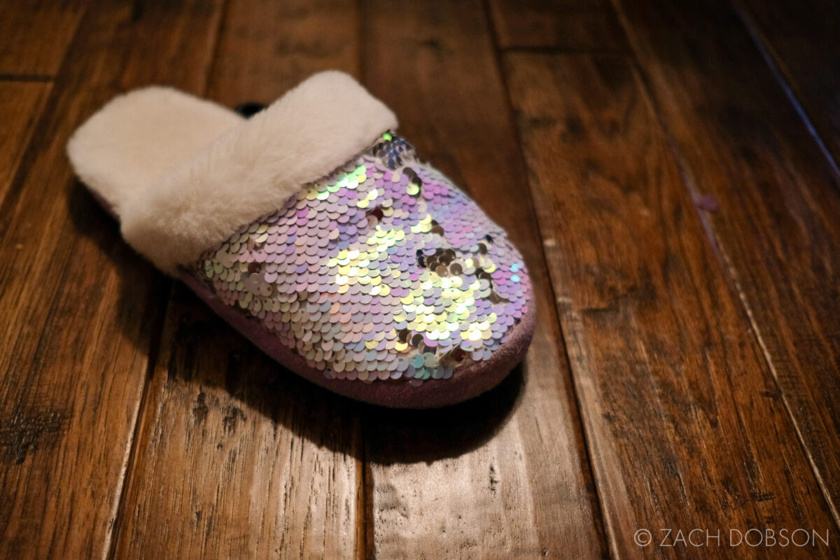 kids sequin slipper on hardwood floor