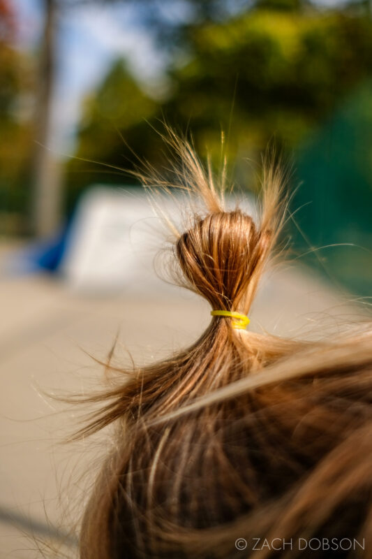 toddler's hair in a top-knot