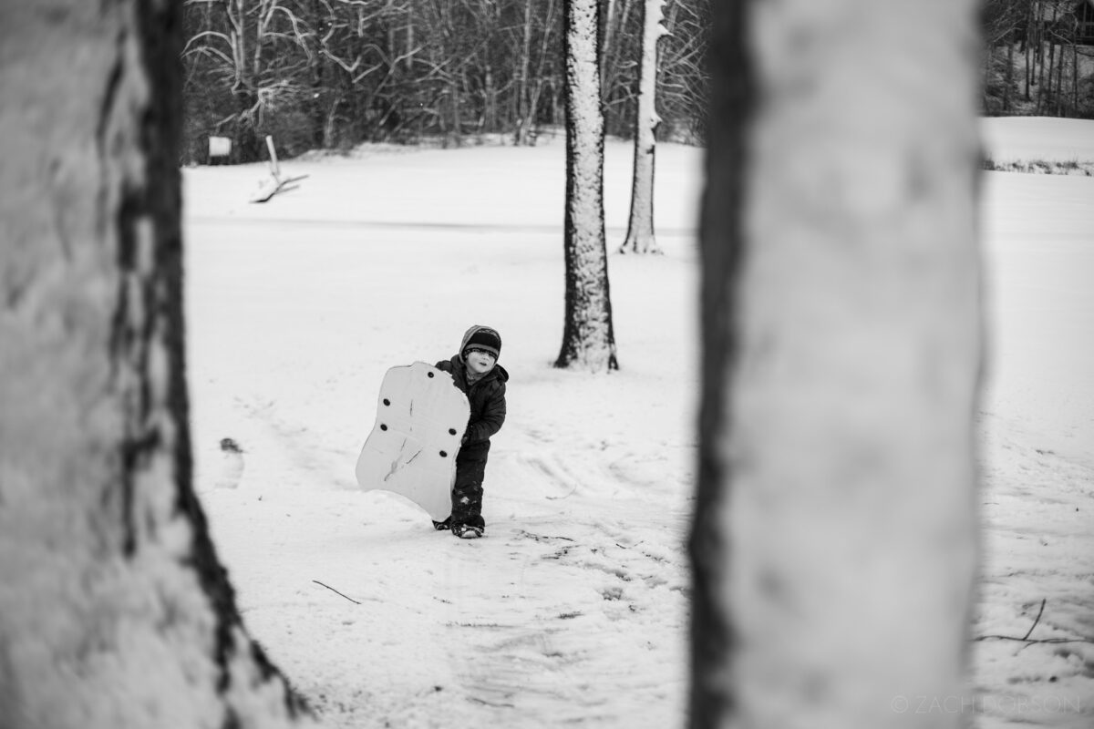 winter, sledding in the snow, carmel, indiana, black & white
