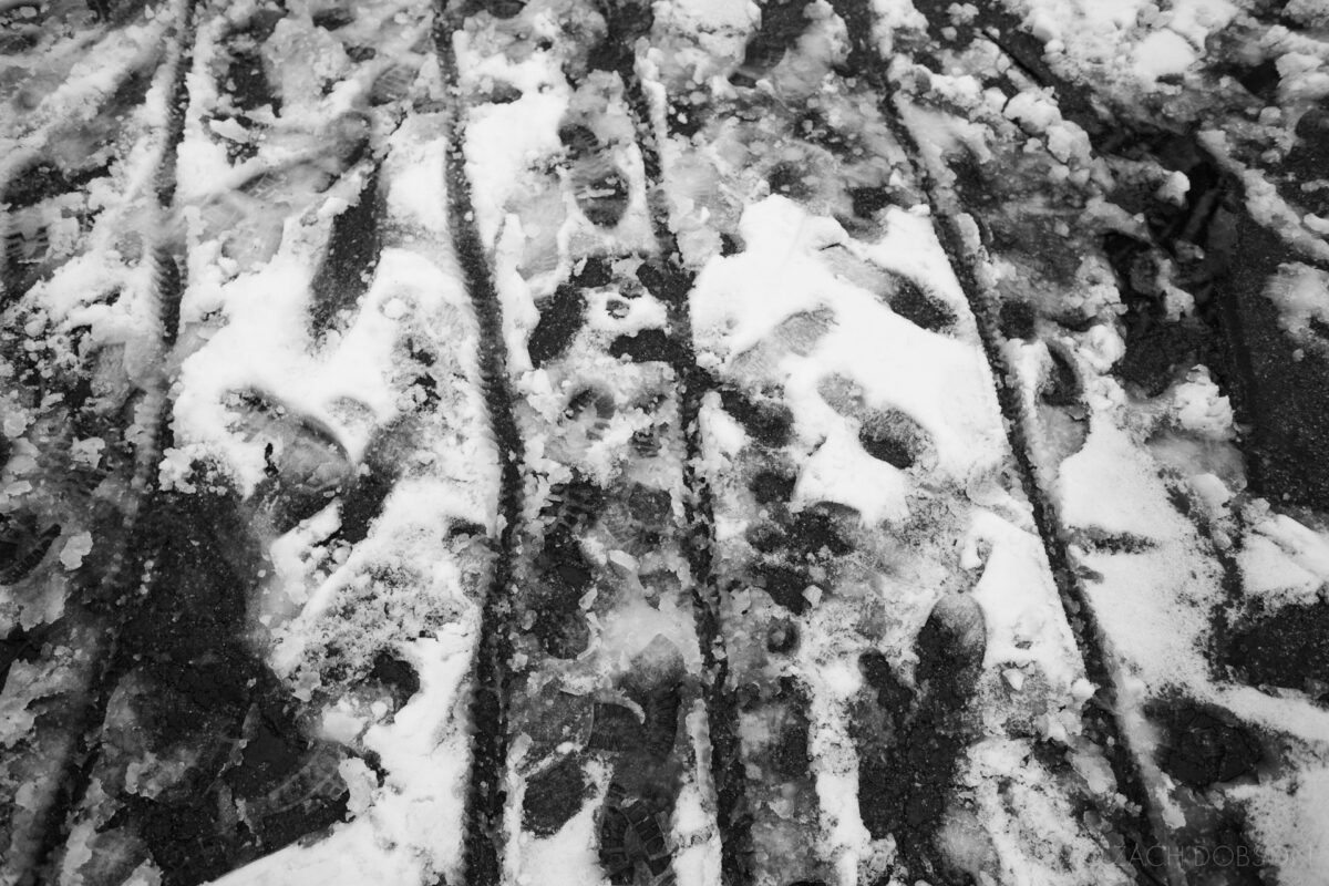 winter, tire tracks and footprints in the snow, carmel, indiana, black & white