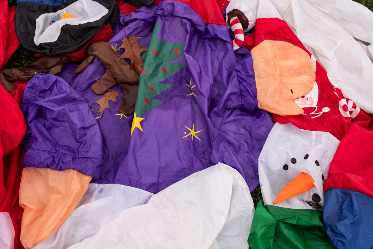 "Holidays Deflated" ©Zach Dobson Top 10 Photos 2024  Close up of deflated Christmas/snowman decor. Carmel, Indiana.