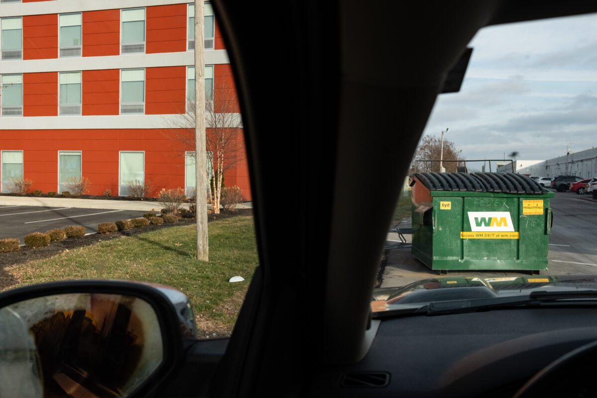 "Behind FedEx" ©Zach Dobson Top 10 Photos 2024  Trash bin and hotel behind a strip mall in Indianapolis, Indiana.