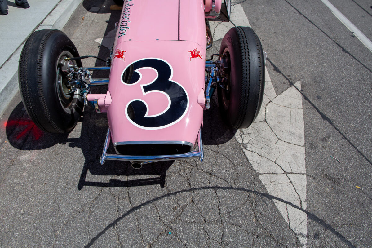 A vintage pink Indy Car at Carmel Artomobilia 2024