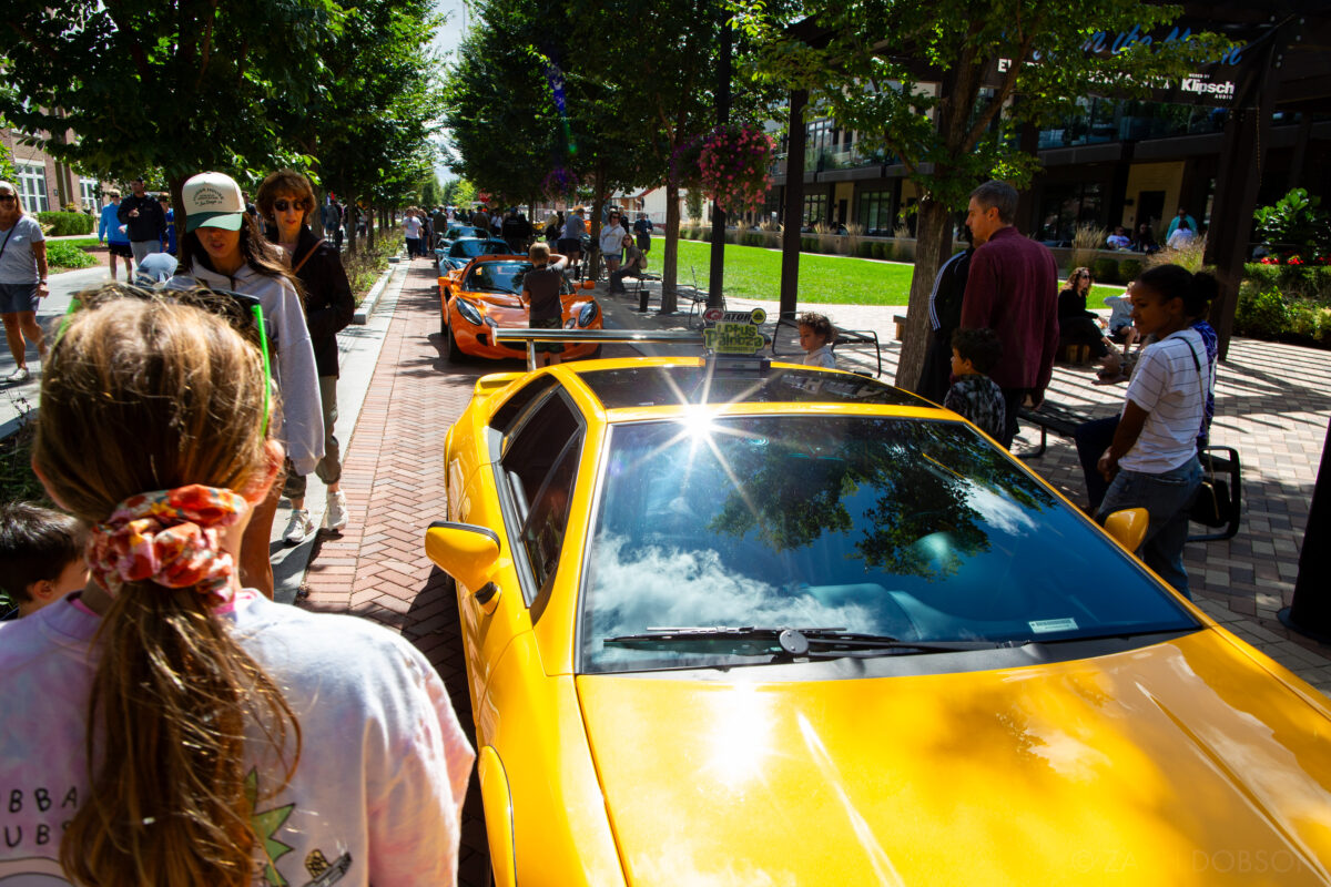 A row of Lotus cars at Carmel Artomobilia 2024 color photography