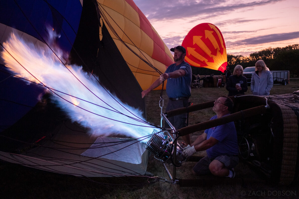 Hot air balloon team filling their balloon at a  Balloon Glow - Jupiter Flights Balloon Festival at Conner Prairie Image: Zach Dobson Photography