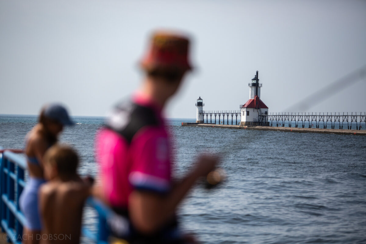 Fishing on the south pier where Lake Michigan meets St. Joseph River with a view of the North Pier  inner & outer lighthouses.