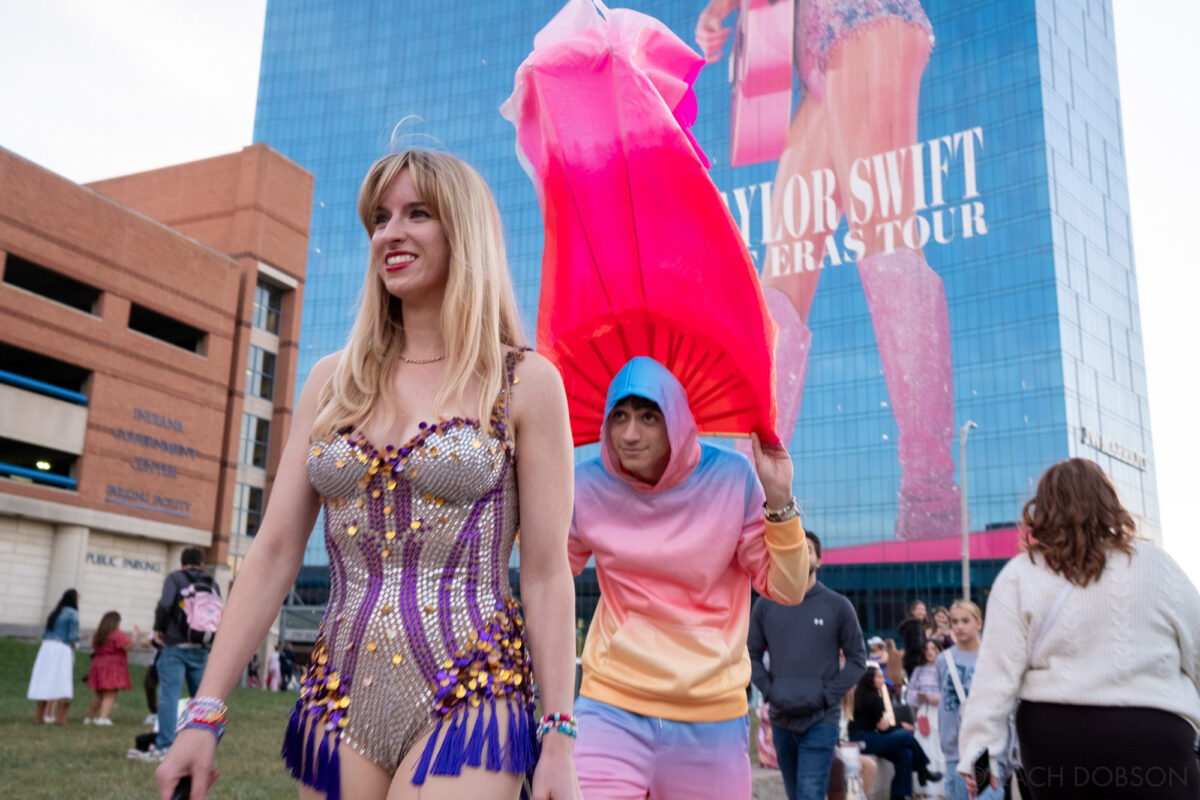 Fans dressed as Taylor Swift and a dancer outside the JW Marriott Indianapolis