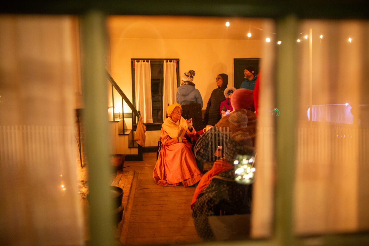 Photographing by candlelight at A Merry Prairie Holiday in Fishers, Indiana