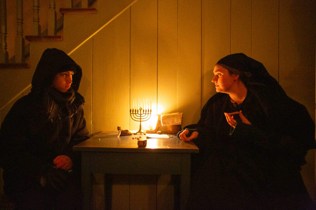 Photographing by candlelight at A Merry Prairie Holiday in Fishers, Indiana