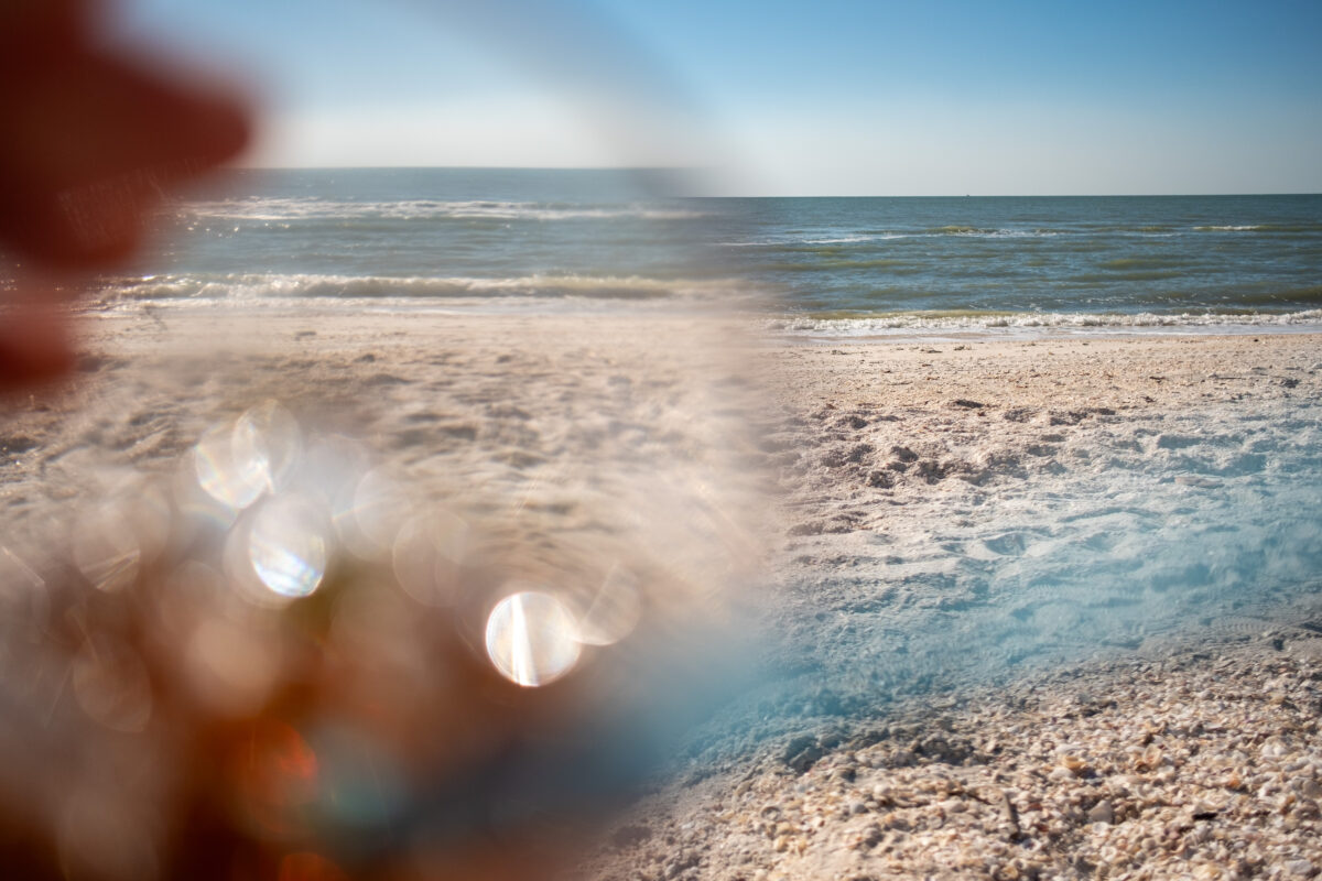 Looking at the Gulf of Mexico through a drinking glass. Bonita Springs, Florida.